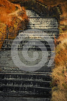 Concrete water cascade Dovestone Reservoir England