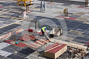 Concrete workers carpenters preparing construction formwork for