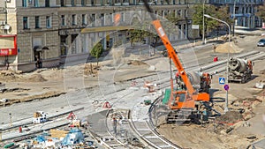 Concrete works for road construction with many workers and mixer timelapse