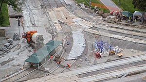 Concrete works for road maintenance construction with many workers and mixer timelapse