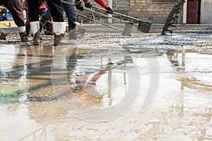 Concreteer adjusting the concrete floor