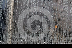 condensate flowing water on the window glass or steam after heavy rain, large texture or background