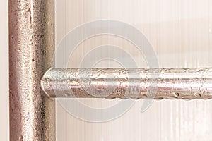 condensate on a steel pipe. Water accident and leak concept