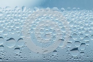 Condensation abstract water drops on the window glass