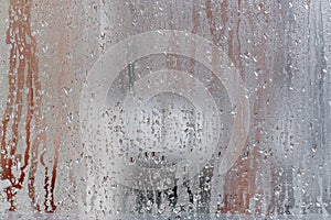 Condensation on the clear glass window, Water drops, Rain. Window glass with high air humidity. Background of natural water