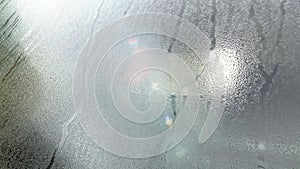 a condensation dew glass car water wet windshield window rain rainy mist moist vehicle drops moisture fog transparent light close-