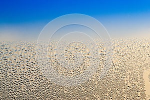 Condensation on a Window with Blue Background