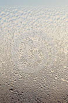 Condensation on a Window with Blue Background