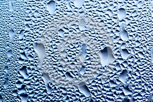 Condensation on a Window with Blue Background