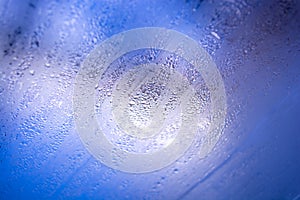 Condensation on the window. Raindrops on the glass. Abstract background