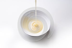 Condensed milk isolated on a white background