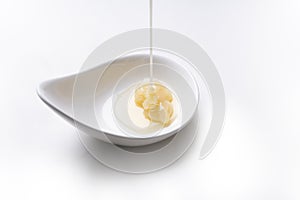 Condensed milk isolated on a white background, food and dessert concept