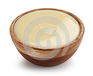 condensed milk in wooden bowl