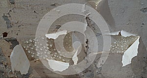 condensed water drops on the basement ceiling with peeled off paint - close-up with selective focus