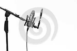 Condenser Mic On Stand In Studio Isolated On White