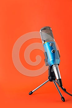 Condenser microphone on color background