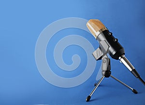 Condenser microphone on color background