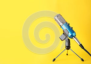 Condenser microphone on color background