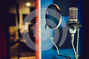 Condenser microphone in a recording studio, pop filter
