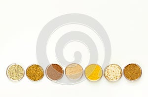 Condiments and herbs on white background. Flat lay. Top view