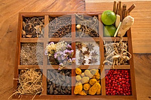 Condiments and spices in the wooden box on the table
