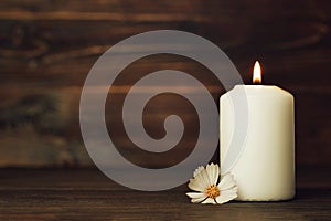 Condolence card with white burning candle and flower