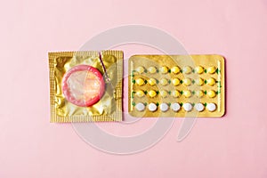 Condom on wrapper pack and contraceptive pills blister