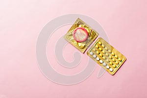 Condom on wrapper pack and contraceptive pills blister