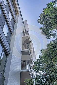 Condominium units against trees and blue sky in San Francisco Califronia