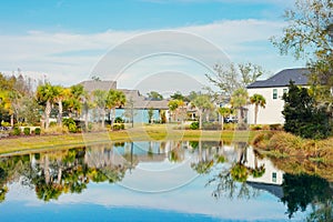 Condos or apartments and a small pond