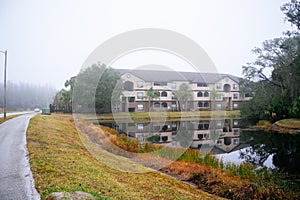 Condos or apartments and a small pond