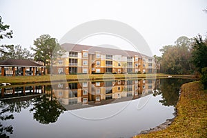 Condos or apartments and a small pond