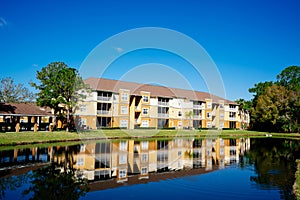 Condos or apartments and a small pond