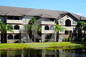 Condos or apartments and a small pond