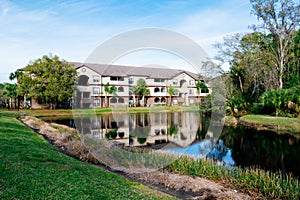 Condos or apartments and a small pond