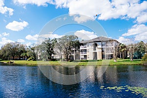 Condos or apartments and a small pond