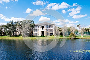 Condos or apartments and a small pond