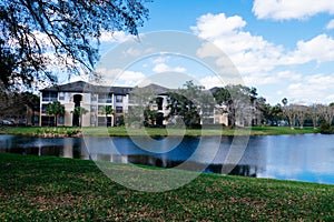 Condos or apartments and a small pond