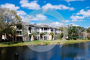 Condos or apartments and a small pond