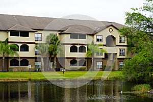 Condos or apartments and a small pond