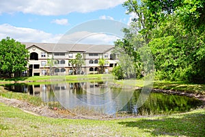 Condos or apartments and a small pond