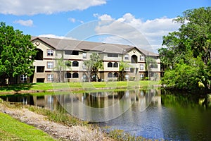 Condos or apartments and a small pond