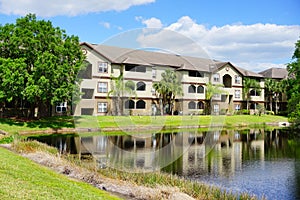 Condos or apartments and a small pond