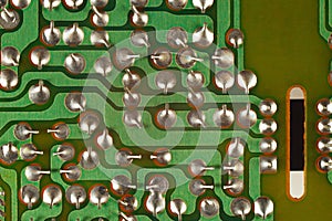 Conductive tracks on an electronic circuit board from modern device.