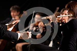 Conductor directing symphony orchestra