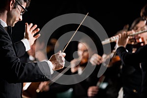 Conductor directing symphony orchestra