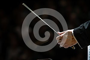 conductors baton during a delicate solo cue