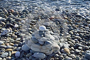cone is formed of pebbles on seashore