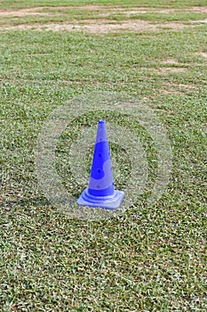 Cone markers on the green grass playground