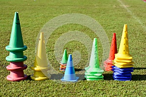 Cone markers on the green grass playground